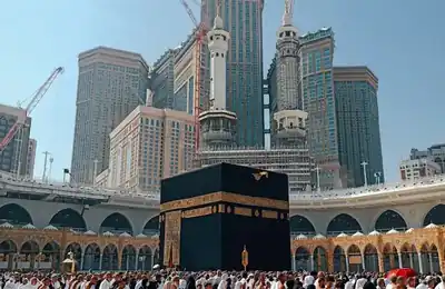 The Kaaba with Makkah Clock Tower behind, Makkah — umrah packages uk
